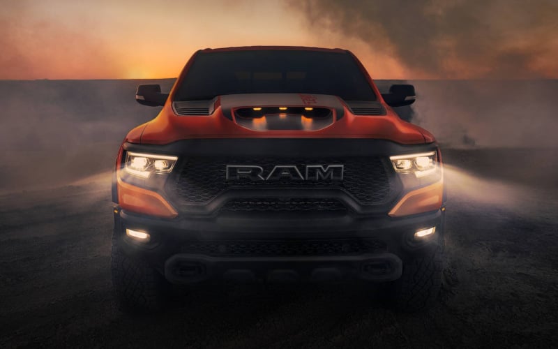 RAM 1500 TRX in the desert, front view with headlights on