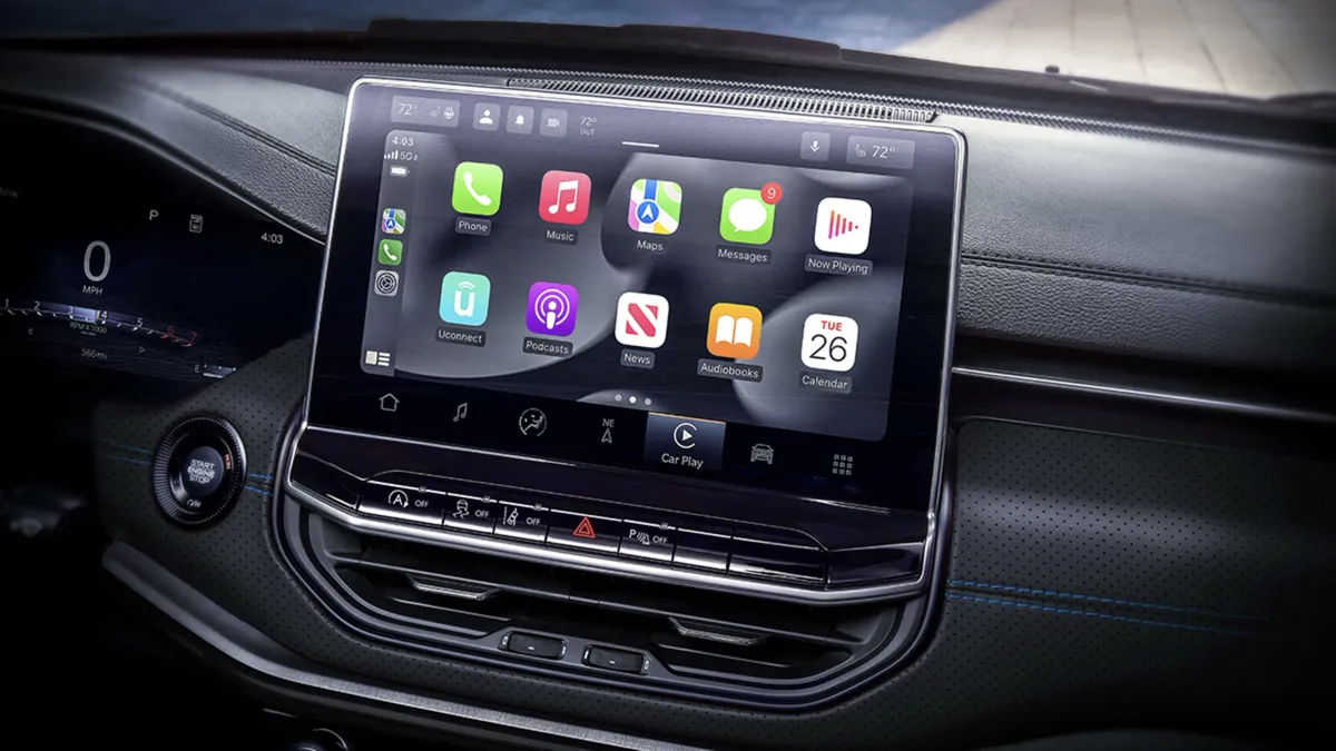 Close-up of the 2026 Jeep Compass infotainment screen displaying Apple CarPlay inside the vehicle.