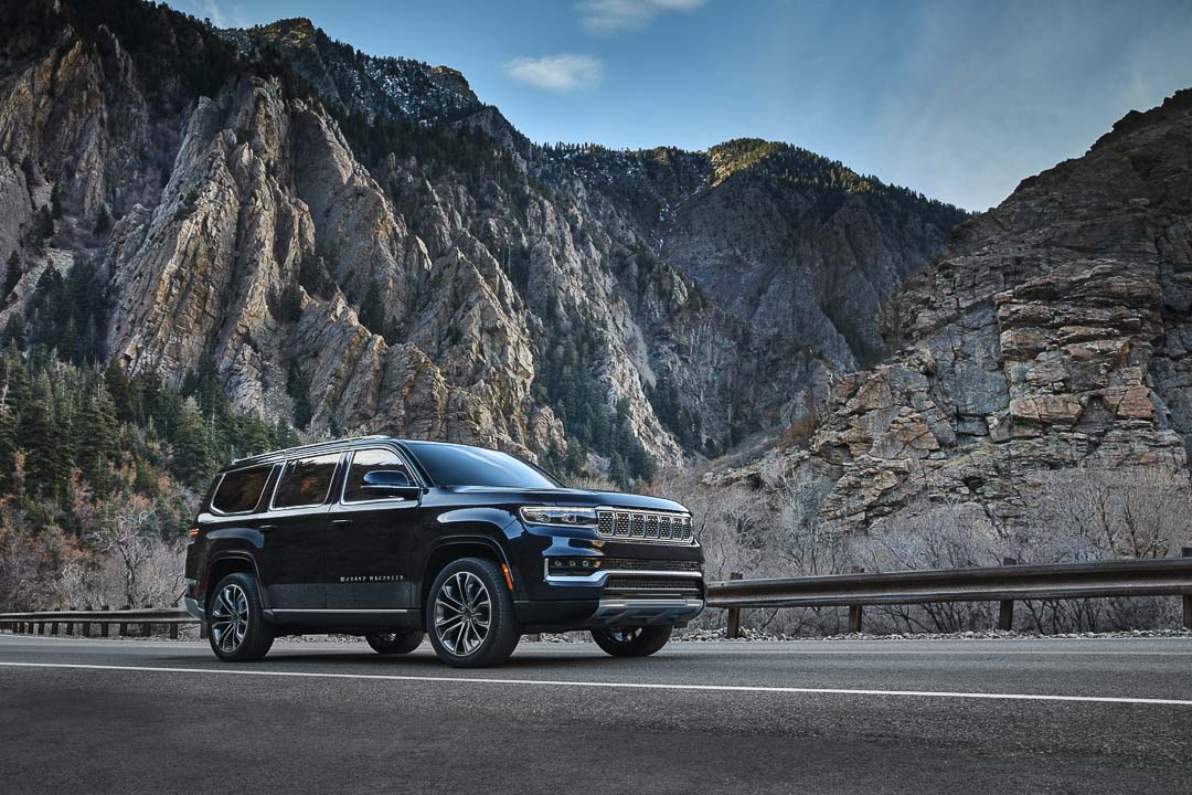 Front 3/4 view of the 2022 Grand Wagoneer Series III model parked on a road.